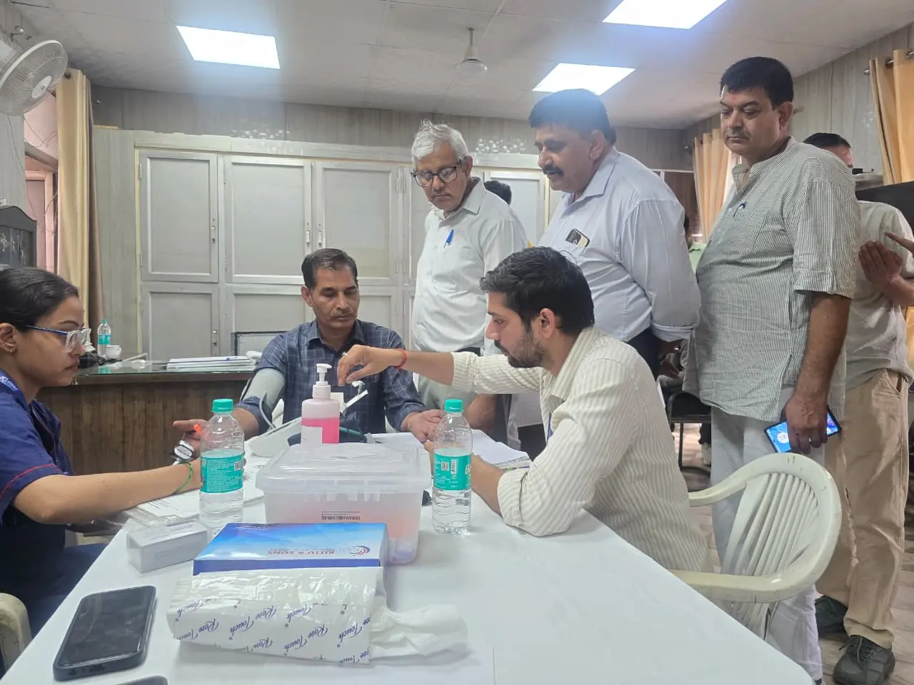 Swasth Bharat Healthcare coordinator assisting a patient and family in hospital